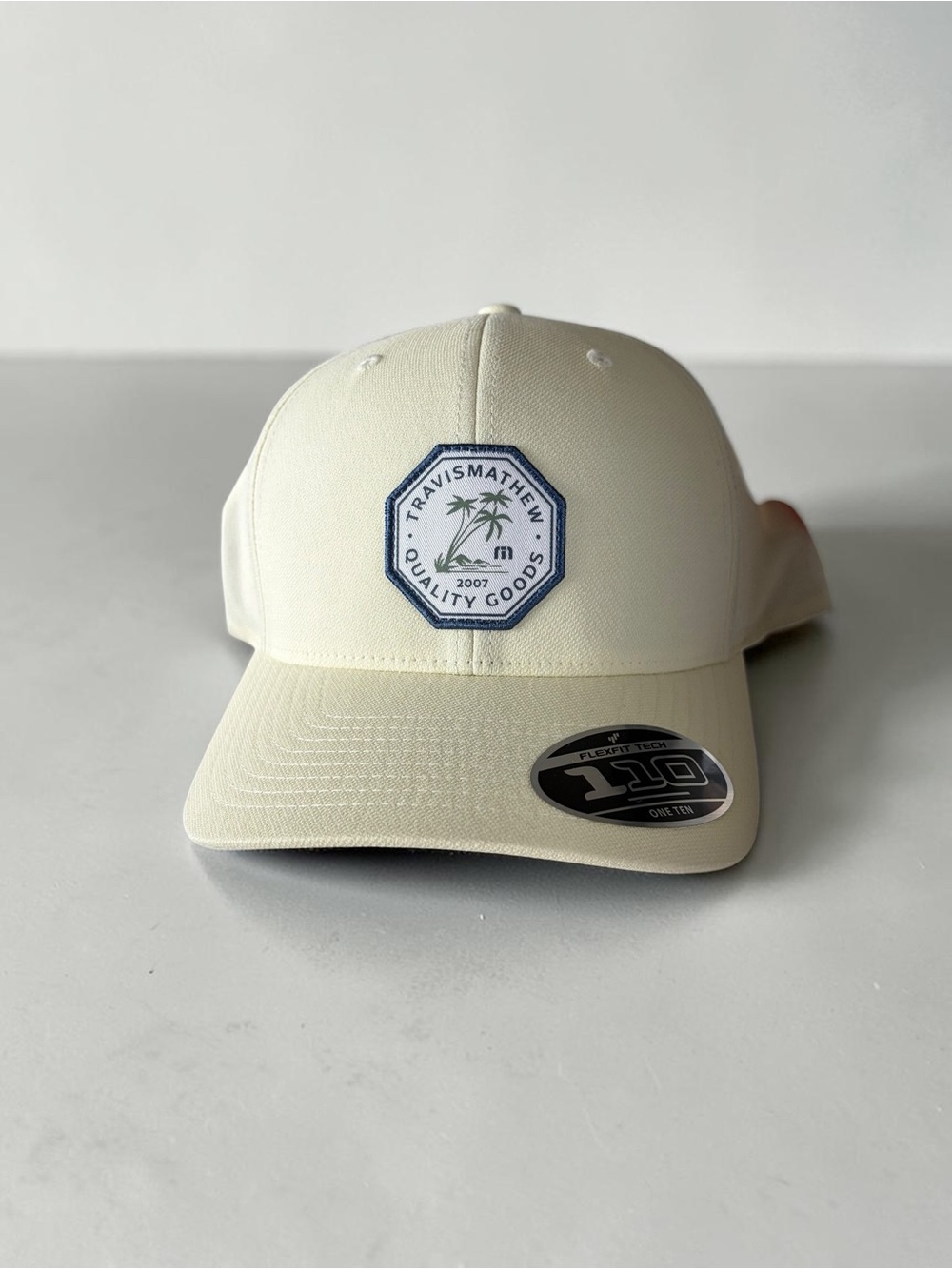 Travis Mathew Men's Cream Patch Logo Baseball Cap